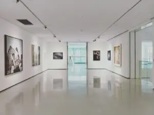 What Art Competition Jurors Actually Look For 1 assorted paintings on white painted wall